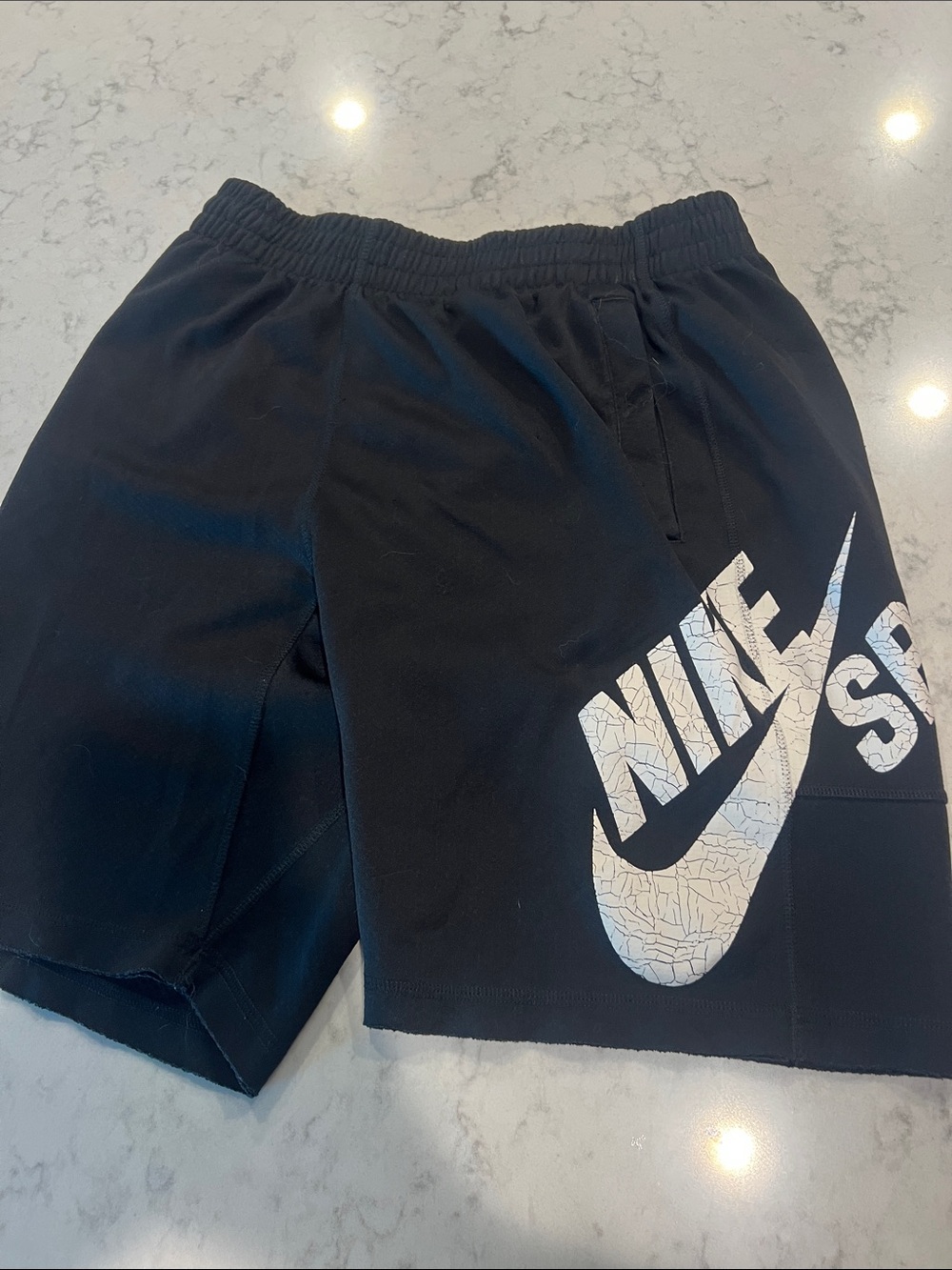 Nike Black Shorts with Large White Swoosh Graphic